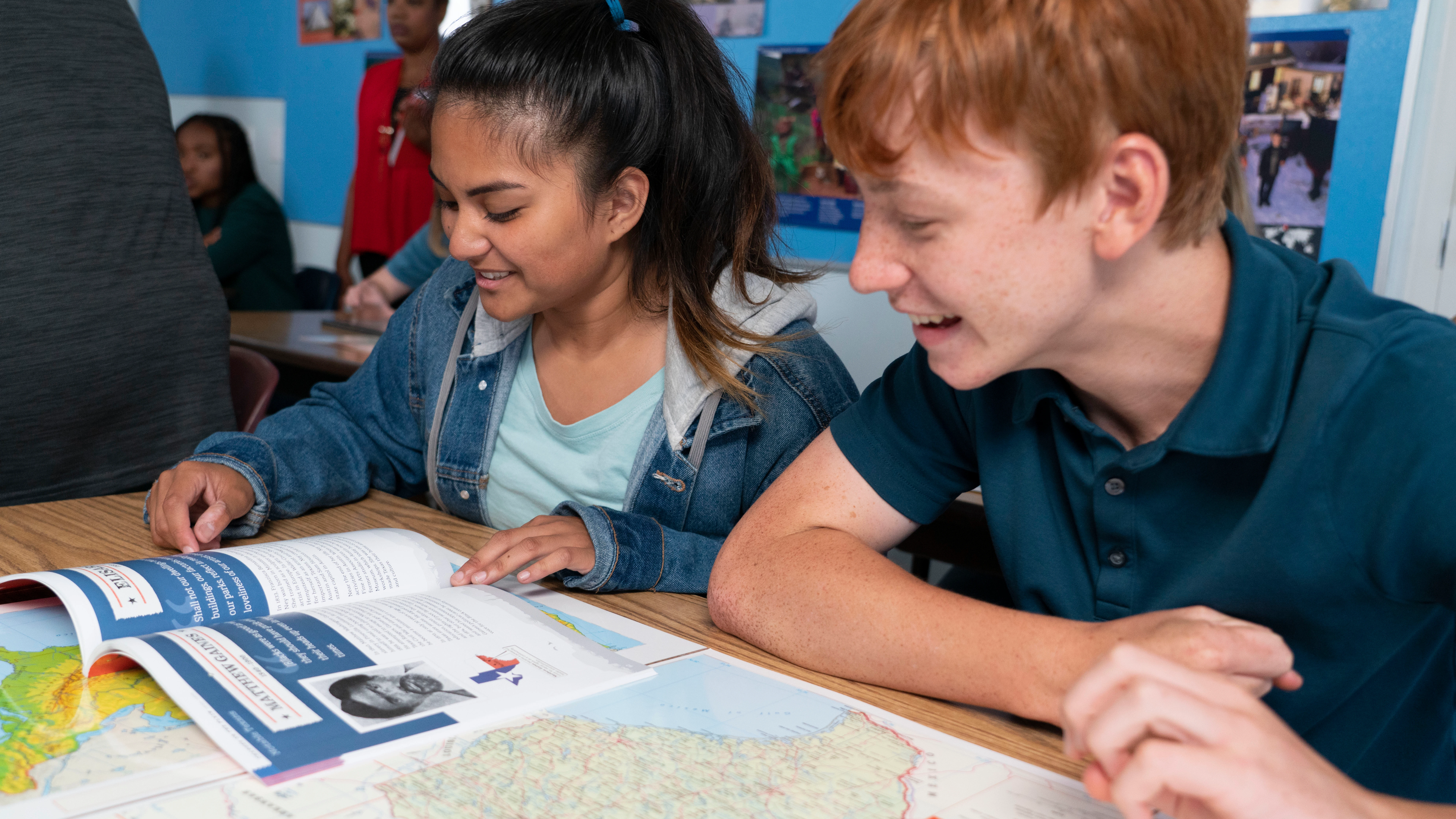 Students working with mapping program materials